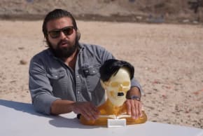 Brandon Herrera, a firearms YouTuber and congressional candidate, poses with a bust of Hitler in a March 2025 video. Herrera is running in the GOP primary against Texas Rep. Tony Gonzales on March 3, 2026.