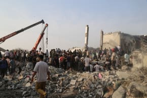 People and rescue forces work following an Israel strike on a school in Minab, Iran, February 28, 2026. 