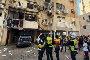 Emergency services arrive at the missile shrapnel impact scene in central Israel. March 3, 2026.