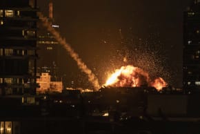  A fireball lights the sky following a missile strike on Tel Aviv on February 28, 2026. The United States and Israel launched strikes against Iran on February 28.