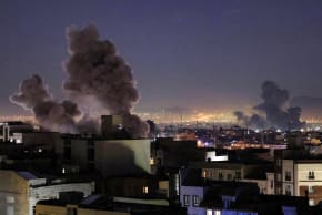 Smoke plumes rise following missile strikes in Tehran on March 1, 2026.