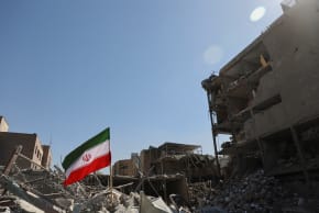 The national flag of Iran flies in the wind as debris lies scattered in the aftermath of an Israeli and U.S. strike on a police station, amid the US-Israeli conflict with Iran, in Tehran, Iran, March 3, 2026. 