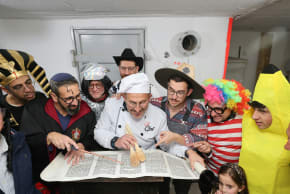 People stand in a bomb shelter and read the Megillah in Jerusalem on March 3, 2026.