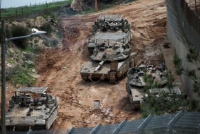Israeli military vehicles at the Israel-Lebanon border, as seen from northern Israel, March 4, 2026