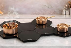 A modular, connectable glass warming system for safe and flexible Shabbat food heating.