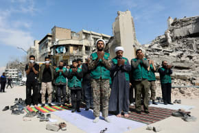 People pray following a strike on a police station, amid the US-Israeli conflict with Iran, in Tehran, Iran, March 4, 2026.