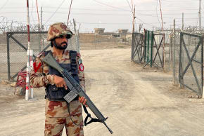 An army soldier stands guard at a deserted entry point at the Friendship Gate, following the exchanges of fire between Pakistan and Afghanistan forces, at the border crossing between the two countries, in Chaman, Pakistan February 27, 2026.