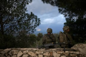 Israeli soldiers observe the border between Lebanon and Israel, following an escalation between Hezbollah and Israel amid the U.S.-Israeli conflict with Iran, as seen from Israel, March 4, 2026. 