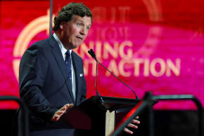 Political commentator Tucker Carlson speaks during a memorial service for slain conservative commentator Charlie Kirk at State Farm Stadium, in Glendale, Arizona, US, September 21, 2025. 