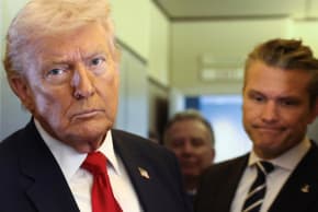 US President Donald Trump, with Secretary of Defense Pete Hegseth at his side, looks on as he speaks to reporters aboard Air Force One on a flight from Dover, Delaware, to Miami, Florida, US, March 7, 2026.