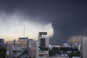 Smoke rises after a reported strike on fuel tanks at an oil refinery in Tehran, Iran, amid the US-Israeli conflict with Iran, March 8, 2026