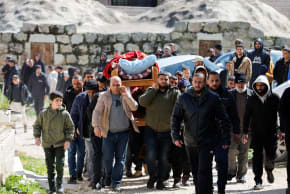Mourners carry the body of a Palestinian reportedly killed by an Israeli settler, near Hebron in the West Bank, March 8, 2026
