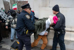 KOSHA DILLZ is led away by police  at a pro- Iran protest in Washington Square Park on March 5, in Manhattan.