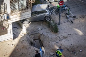 Aftermath of an Iranian ballistic missile attack following impact of missile fragments in central Israel, March 8, 2026 (photo credit: CHAIM GOLDBERG/FLASH90)