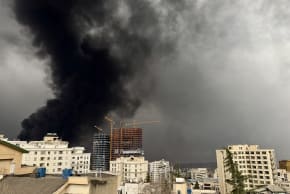 Smoke billows after airstrikes on oil depots on March 8, 2026 in Tehran, Iran. The United States and Israel continued their joint attack on Iran that began on February 28.