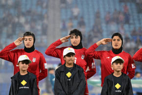 Iran players salute during their national anthem during the AFC Women's Asian Cup Group A match between Iran and Philippines at Gold Coast Stadium on the Gold Coast, Australia, March 8, 2026.