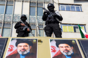 Security forces deploy to guard a rally in support of Iran's new supreme leader at Enghelab Square in central Tehran on March 9, 2026.
