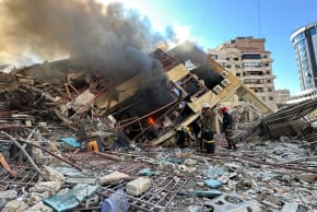 Members of the Lebanese Civil Defence inspect a damaged building after an Israeli strike on Beirut's southern suburbs, following renewed hostilities between Hezbollah and Israel amid the US-Israeli conflict with Iran, Lebanon, March 9, 2026.