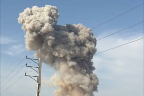 A pillar of smoke and debris rises after a strike on Bushehr, Iran, March 11, 2026.