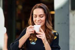 A woman drinking coffee