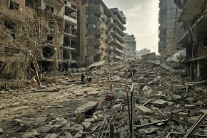 A man looks at the site of overnight Israeli airstrikes in the southern suburbs of Beirut on March 12, 2026. (photo credit: AFP VIA GETTY IMAGES)