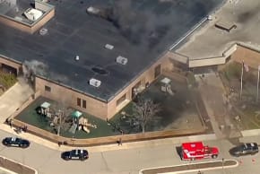 SMOKE RISES from the building after the Michigan State Police reported an active shooting incident at the Temple Israel Synagogue in West Bloomfield, Michigan, US, March 12, 2026 in a still image from video. 