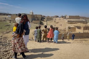 CHILDREN STAND near a house damaged in what the Taliban said was a Pakistani air strike on the outskirts of Kabul, Afghanistan, March 13, 2026.