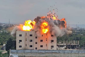 A fireball errupts from the site of an Israeli airstrike that targeted a building in the southern Lebanese village of Abbasiyyeh on March 13, 2026.
