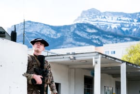 A soldier is stationed at the entrance to the Varces barracks south of Grenoble in the Isere department on Friday 13 March 2026 where was based Chief Warrant Officer Arnaud Frion a soldier with the 7th Alpine Chasseurs Battalion who was killed in an attack in the Erbil region of Iraq.