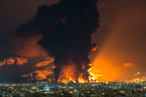 FIRE AND smoke rise at the site of airstrikes on an oil depot in Tehran.