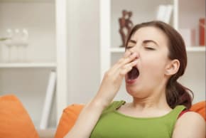 A woman yawning