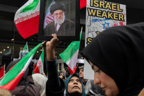 A demonstrator holds a portrait of Iran's late Supreme Leader Ayatollah Ali Khamenei, at Times Square during an Al-Quds Day rally in Manhattan, New York City, US, March 13, 2026. 