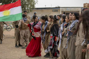 Kurdish women dance hand in hand as the Democratic Party of Iranian Kurdistan (PDKI) members celebrate Nowruz at the Jezhnikan Village around Baharka, Iraq, on March 18, 2025.