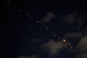 Rocket trails are seen in the sky above the Israeli center coastal city of Netanya amid a fresh barrage of Iranian missile attacks on March 9, 2026.