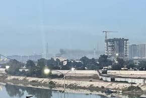 Smoke rises following a drone attack on the US embassy in Baghdad on March 14, 2026. A drone struck the US embassy in Baghdad on March 14, an Iraqi security official said, as an AFP journalist saw smoke rising from the complex.