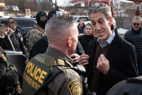 Evanston mayor and congressional candidate Daniel Biss, right, confronts U.S. Border Patrol Chief Gregory Bovino in Evanston, Illinois,  Dec. 17, 2025.