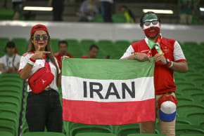 Iranian fans display a flag reading "IRAN" before the match between Iran and the USA in Group B of the 2022 World Cup at Al Thumama Stadium in Doha, Qatar, on November 29, 2022.