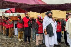 People carry the coffins of victims, who died in what the Taliban said was a Pakistani air strike on a drug rehabilitation centre, during a mass burial, in Kabul, Afghanistan, March 18, 2026.