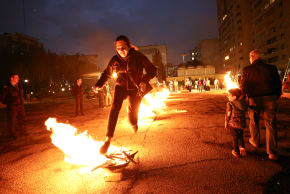 Iranians jump over fire during the celebrations of Chaharshanbe Suri on the eve of the last Wednesday of the year before Nowruz on March 14, 2023 in Tehran, Iran.
