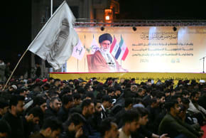 Members of the Hashd al-Shaabi gather in Basra, southern Iraq, to hold a memorial ceremony for Ayatollah Ali Khamenei, carrying Khamenei posters and Hashd al-Shaabi and Kataib Hezbollah flags while chanting slogans in support of Iran on March 08, 2026.