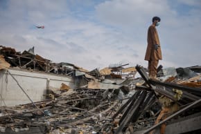 A man stands on the debris at the site of a drug rehabilitation hospital destroyed in what the Taliban said was a Pakistani air strike in Kabul, Afghanistan, March 17, 2026.