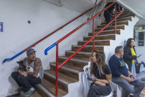 People take cover in a bomb shelter from incoming missiles fired from Iran in Holon, March 17, 2026.