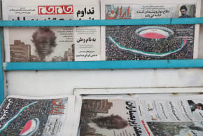 Iranian newspapers with cover photos related to the annual al-Quds Day (Jerusalem Day) protests, amid the US-Israeli conflict with Iran, in Tehran, Iran, March 14, 2026.