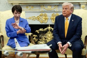 Japanese Prime Minister Sanae Takaichi looks at her watch during a meeting with U.S. President Donald Trump in the Oval Office at the White House in Washington, March 19, 2026.