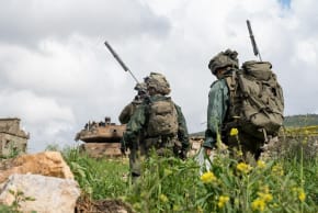 IDF soldiers and a tank operate in southern Lebanon on March 21, 2026.
