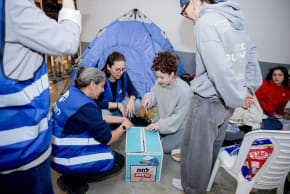 Latet volunteers distribute food boxes in public shelters in Tel Aviv.