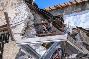 Israeli security and rescue forces at the scene where a missile fired from Iran toward Israel caused damage in Tel Aviv, March 22, 2026