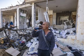 The scene where a missile fired from Iran toward Israel caused damage to residential buildings in the southern Israeli city of Dimona, March 22, 2026.
