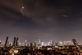 Streaks of light illuminate the sky during an interception attempt amid the US-Israeli conflict with Iran, as seen from Tel Aviv, Israel, March 23, 2026.