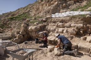 Workers and volunteers on an archaeological dig sift through dirt at Alexandrion/Sartaba in the Jordan Valley.